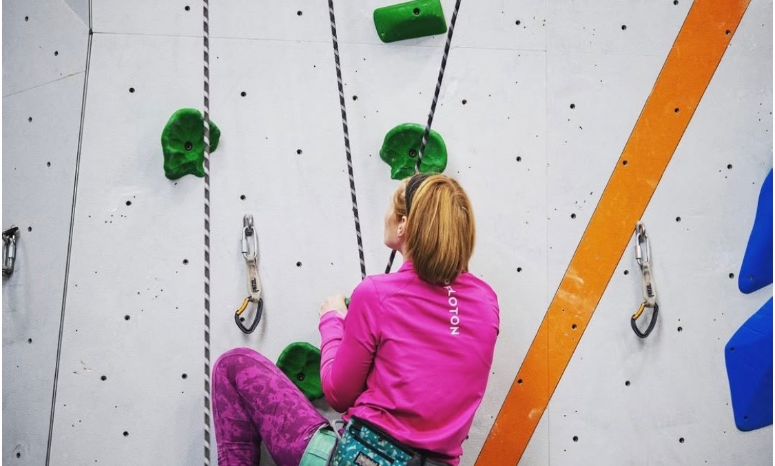 Kara is rock climbing.