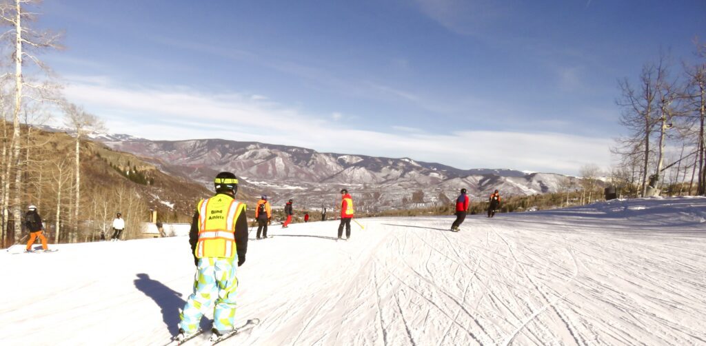 This is a pictures of the ski slopes with mountains in the background.